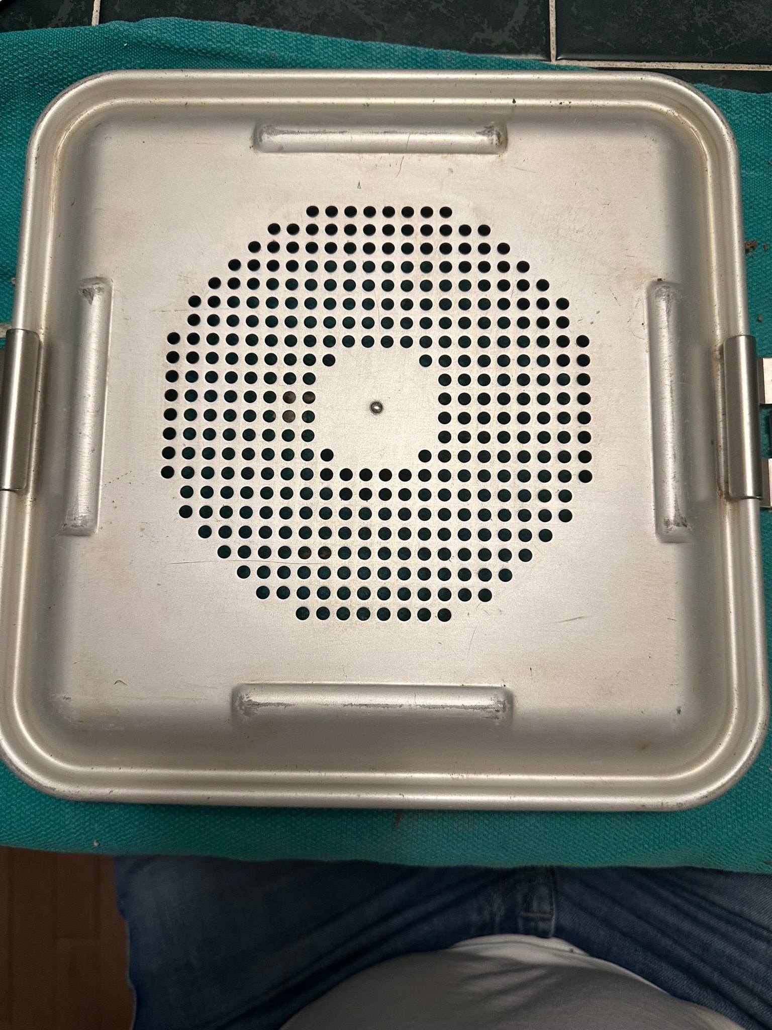 Sterile container after cleaning — clean perforated surface